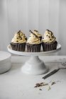 Chocolate cupcakes on cake stand — Stock Photo