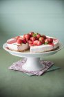 Strawberry cheesecake on cake stand — Stock Photo