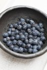 Blueberries in old bowl — Stock Photo