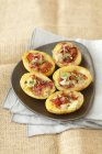 Baked potatoes with bacon — Stock Photo