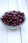 Sour cherries in bowl — Stock Photo