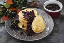 Pancakes with aronia berries — Stock Photo