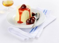 Ricotta ice cream with cherry sauce — Stock Photo