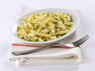 Strozzapreti pasta with gorgonzola and pear — Stock Photo