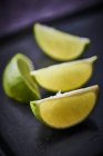 Fresh lime wedges — Stock Photo