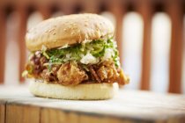 Burger with fried oysters — Stock Photo