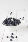 Fresh Blueberries in enamel bowl — Stock Photo