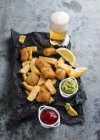 Fish and chips with avocado cream — Stock Photo