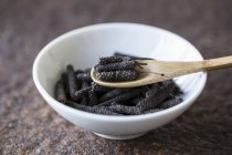 Dried Long pepper with wooden spoon — Stock Photo