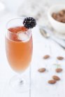 Kir cocktail with a blackberry — Stock Photo