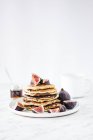 Pile of pancakes with figs — Stock Photo