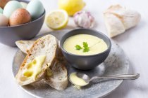Aioli and bread with ingredients — Stock Photo