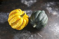 Two winter squash  on rustic wooden surface — Stock Photo