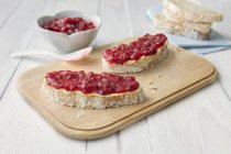 Raspberry jam on bread — Stock Photo