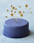 Blue party cake with star decorations — Stock Photo