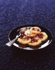 Closeup view of candied orange slices with pomegranate seeds — Stock Photo