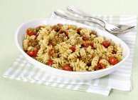 Fusilli with gratinated tomatoes — Stock Photo
