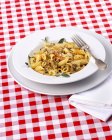 Penne pasta with herbs and minced meat — Stock Photo
