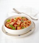 Orecchiette with chilli peppers and basil — Stock Photo