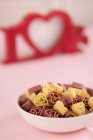 Bowl full of heart-shaped pasta — Stock Photo
