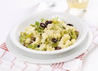 Fusilli pasta with feta and olives — Stock Photo