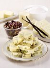 Closeup view of white chocolate chunks with pistachios — Stock Photo