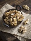 Walnuts in copper bowl — Stock Photo