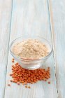 Lentil flour and red lentils — Stock Photo