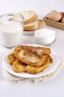 French toasts with milk, sugar, bread and eggs — Stock Photo