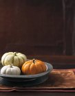 Pumpkins in metal dish — Stock Photo