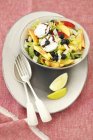 Green leaf and fruit salad — Stock Photo