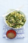 Farfalle with spinach, courgette and salami — Stock Photo