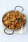 Sauerkraut and cabbage braised with sausage, bacon and mushrooms — Stock Photo