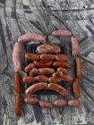 Top view of Salsiccia sausages arranged with a grill pan — Stock Photo