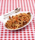 Bucatini pasta all'amatriciana with seafood — Stock Photo