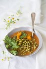 Pea and carrot soup with fresh parsley — Stock Photo