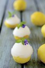 Lemon sorbet served in lemon halves — Stock Photo