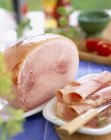 White ham and slices — Stock Photo