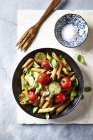 Wholegrain penne pasta with cherry tomatoes — Stock Photo