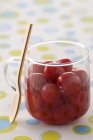 Cherries in syrup in jar — Stock Photo