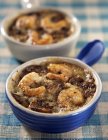 Small casserole dishes of seafood with mushrooms — Stock Photo