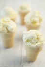 Lemon meringue ice cream in cones — Stock Photo