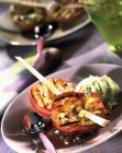 Closeup view of grilled peaches pricked with pistachios — Stock Photo