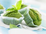 Pesto muffins with basil leaves — Stock Photo