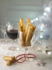 Cheese straws and wine — Stock Photo