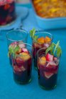 Sangria with sliced fruits — Stock Photo