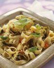 Freesh tagliatelle pasta with artichokes — Stock Photo