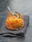 Grated carrots in glass — Stock Photo