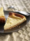 Sliced Cheesecake on plate — Stock Photo