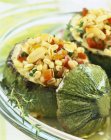 Courgettes stuffed with wheat on glass plate — Stock Photo